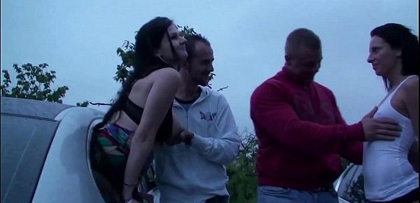  A girl is joining dogging public sex orgy with strangers in the middle of action